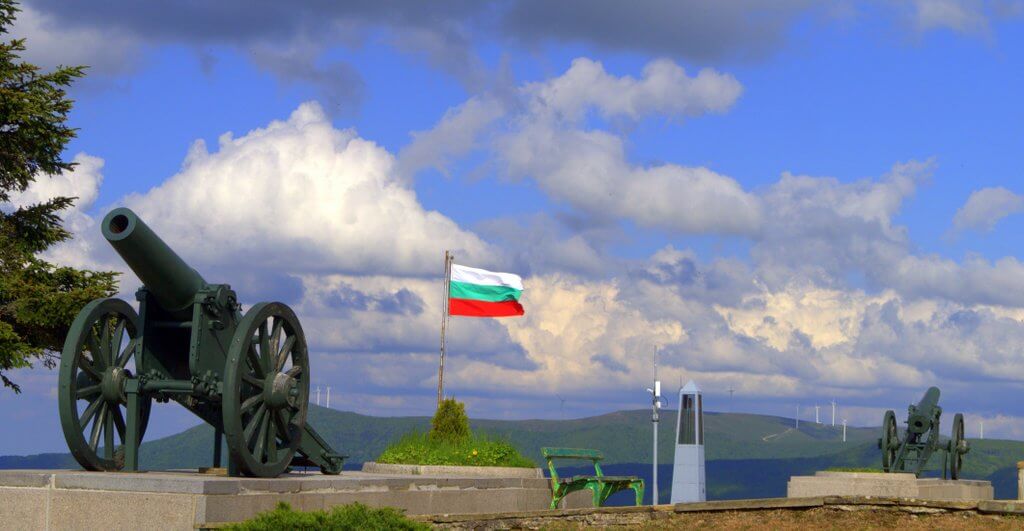 The bulgarian flag and a cannon, view towards northern Bulgaria